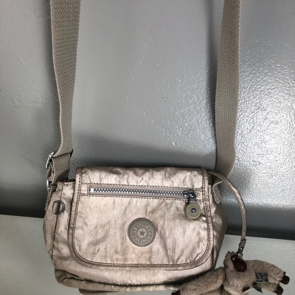 Kipling small crossbody bag with monkey, in silver